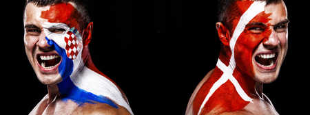 Soccer or football fan with bodyart on face with agression - flag of Croatia vs Denmark.の写真素材