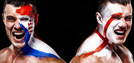 Soccer or football fan athlete with bodyart on face - flags of Croatia vs England. Sport Concept with copyspace.の写真素材