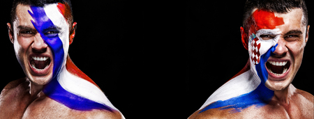Soccer or football fan athlete with bodyart on face - flags of France vs Croatia. Sport Concept with copyspace. Final.の写真素材