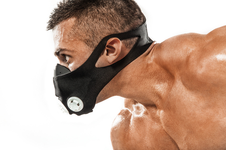 Athletic shirtless young sports man - fitness model with barbell.の写真素材