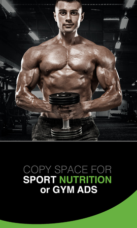 Athletic shirtless young sports man - fitness model with barbell in gym.の写真素材