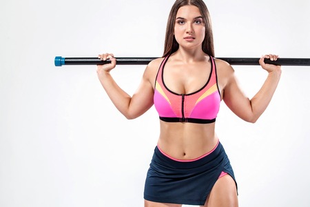 Size plus fitness sports woman, athlete with strong fit body with body bar on white background.の写真素材