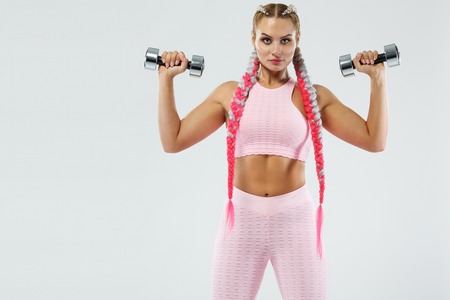 Sporty beautiful woman exercising to stay fitの写真素材