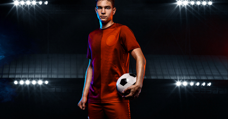 Teenager - soccer player. Boy in football sportswear after game with ball. Sport concept.の写真素材