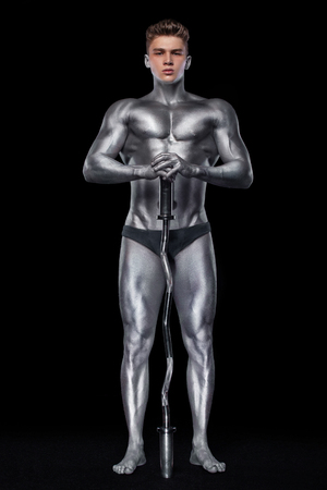 Brutal strong muscular bodybuilder athletic man pumping up muscles with barbell on black background. Workout bodybuilding concept. Copy space for sport nutrition ads.の写真素材