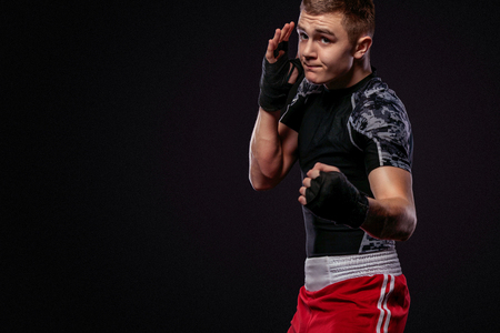 Sportsman, man boxer fighting in gloves. on black backgroundの写真素材