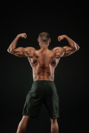 Bodybuilding competitions on the scene. Man sportsmen bodybuilder physique and athlete. Fitness motivation.の写真素材