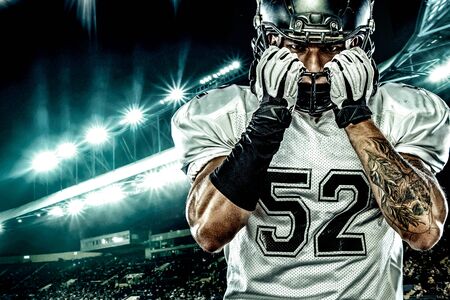 American Football player on stadium with smoke and lights.の写真素材