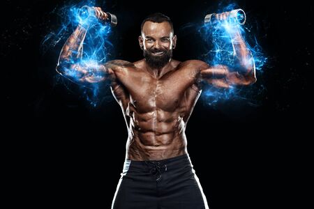 Strong and fit man bodybuilder. Sporty muscular guy with dumbbells. Spot and fitness motivation....
