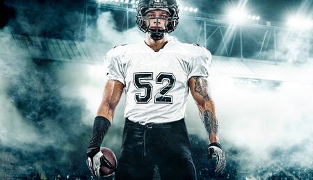 American Football player on stadium with smoke and lights.の写真素材