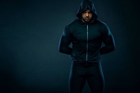 Muscular fitness sports man, atlete with chains in fitness gym. Energy and power.の写真素材