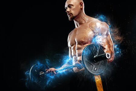 Strong and fit man bodybuilder. Sporty muscular guy with barbell. Sport and fitness motivation. Individual sports recreation.の写真素材