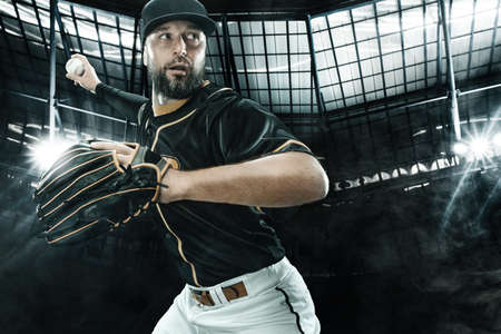 Porfessional baseball player with bat taking a swing on grand arena. Ballplayer on stadium in...