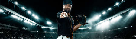 Wide photo. Porfessional baseball player with ball on grand arena. Ballplayer on stadium in action.