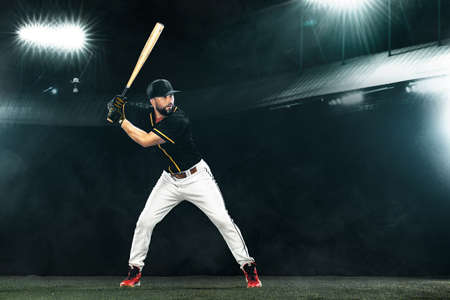Porfessional baseball player with bat on grand arena. Ballplayer on stadium.の写真素材