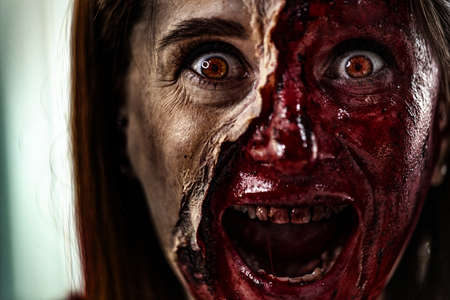 Zombie makeup on Halloween 2020. Creative art make-up for eve of All Saints Day party. Creepy bloody...