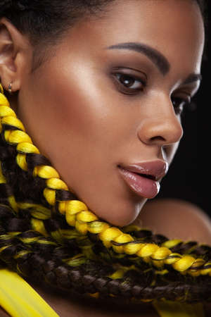 Closeup face fith yellow braids. Portrait of an African American Black Woman.の写真素材