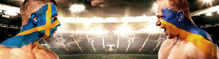 Match 43 Sweden vs Ukraine. Soccer or football athlete with flag bodyart on face. Sport concept with copyspace.の写真素材