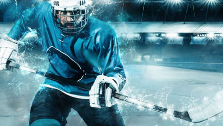 Ice Hockey player athlete in the helmet and gloves on stadium with stick. Action shot. Sport concept.の写真素材