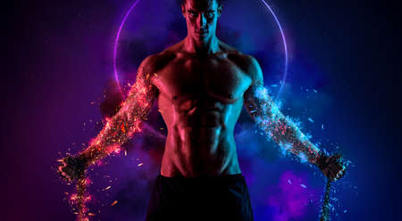 Boxing concept. Sportsman muay thai boxer fighting in gloves. Isolated on neon background. Copy Space.の写真素材