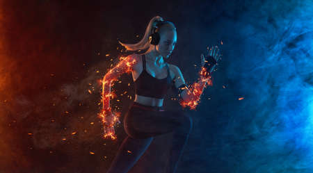 Sprinter run. Strong athletic woman running on black background wearing in the sportswear. Fitness...