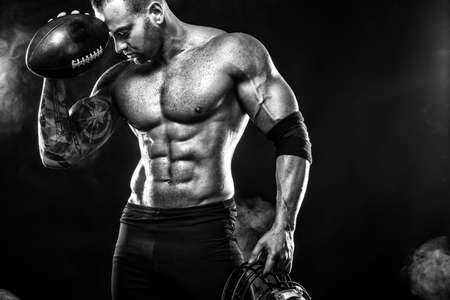 Sport concept. American football sportsman player on black background. Sport concept.の写真素材