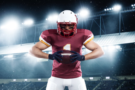 American football player on stadium before game. Template for a sports magazine on the theme of American football with copy space. Mockup for betting advertisement.の写真素材