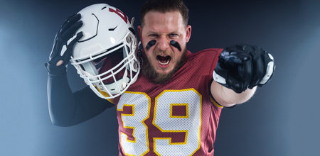 American football player banner for ads. Photo for a sports magazine or website. Picture for betting advertisement.の写真素材