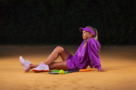 Tennis player. Girl teenager athlete with racket on tennis court. Download photo for advertising in tennis and sports for social networksの写真素材