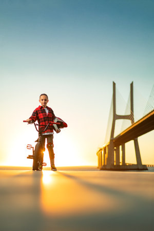 Teenage BMX rider is prepearing to tricks in skatepark.の写真素材