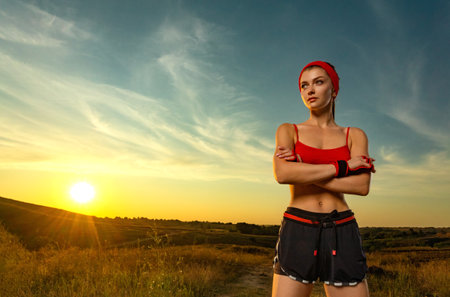 Fit woman Influencer outdoors. Download photo for advertising a fitness club in social networks. Workout for women outdoor. Cover for sport motivation music. Runner conceptの写真素材