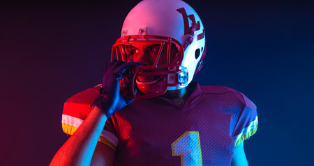 American football player. Download high resolution photo for sports design. Horizontal banner in neon colors. Mockup for betting advertisement.の写真素材