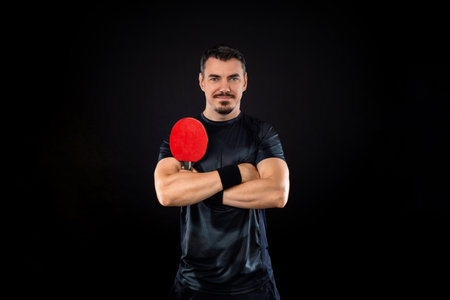 Table tennis player on the black background.   banner. Download a photo of a table tennis player for a tenis racket packaging design. Image for tennis ball box template.の写真素材