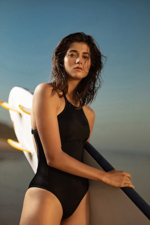 Surfing. Girl surfer. Download a photo with copy space to advertise tours to a warm country. Surfing...