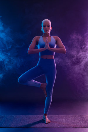 Yoga Classes Indoor. Sports recreation. Beautiful black young woman. Individual sports.の写真素材