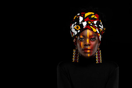 African girl in a national headdress. Copy space to advertise an event, Black Friday discounts, or a...