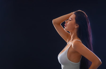 Image of happy young sexy woman posing isolated over grey wall background.の写真素材