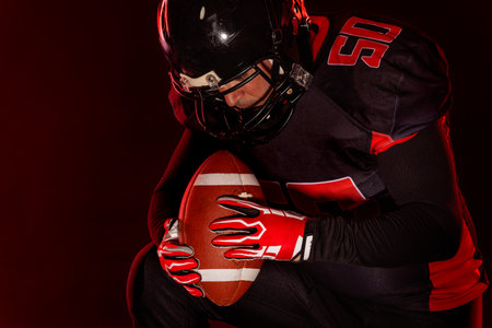 American football player banner on red neon background. Template for bookmaker ads with copy space. Mockup for betting advertisement. Sports betting, football betting, gambling, bookmaker, big winの写真素材