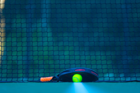 Padel tennis racket. Background with copy space. Sport court and balls.の写真素材