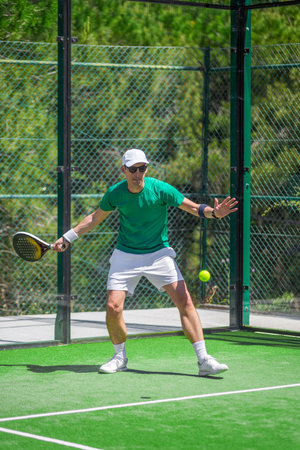 Padel athlete during intense rally great visual for online and print campaignsの写真素材