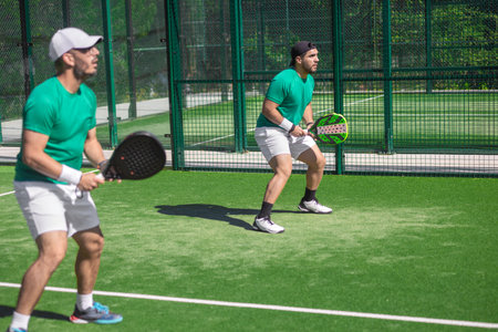 Two padel players. Energetic padel game moment ideal for social media posts and sports adsの写真素材