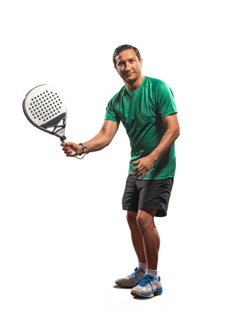 Padel player holding racket isolated on white background, sports event concept, athlete in action, professional game gear, indoor sport sceneの写真素材