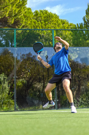 Padel player at outdoor court. Open social tour template. Mockup for social media events with copy space.の写真素材