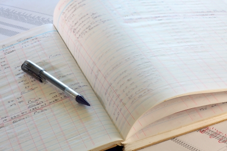 calculating written accounts book adding expenses の写真素材