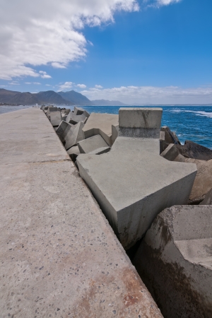 concrete arrows used to protect a harbor pier from wave erosionの写真素材
