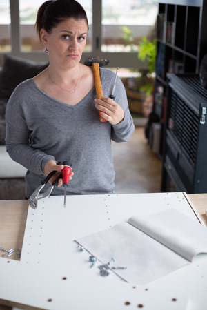 Attractive woman makes DIY at homeの写真素材