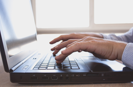 Man works on a laptop Close upの写真素材