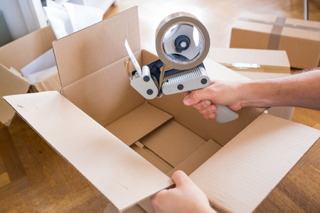 Close-up of Tape and Packaging Cards - House Moving Conceptの写真素材