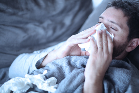 Sick man, flu, cold and he has feverの写真素材