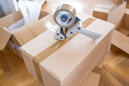 Close-up of Tape and Packaging Cards - House Moving Conceptの写真素材